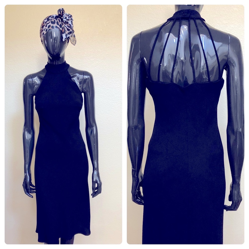 Casual or cocktail black dress with straps in the back. Size 6